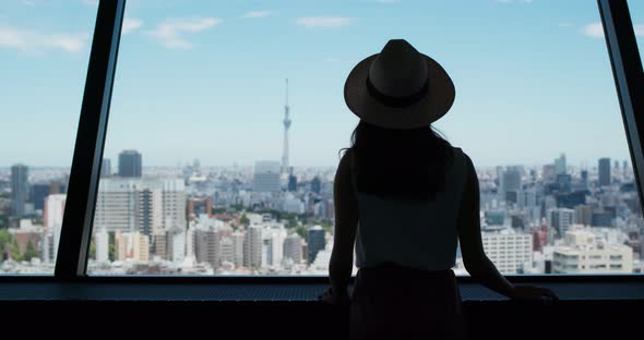 Woman look at the city of Tokyo