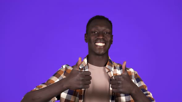 Happy Smiling African American Man in Good Mood on Blue Background