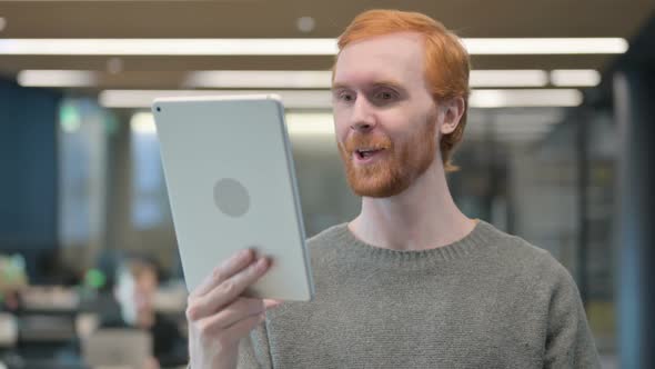 Portrait of Video Call on Tablet By Young Man in Office