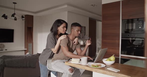 Diverse Couple Shopping Online Together