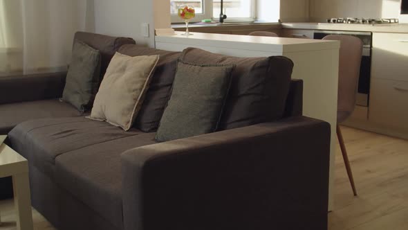 Camera Opening Shot of Laptop and Eyeglasses Lying on End Table Indoor