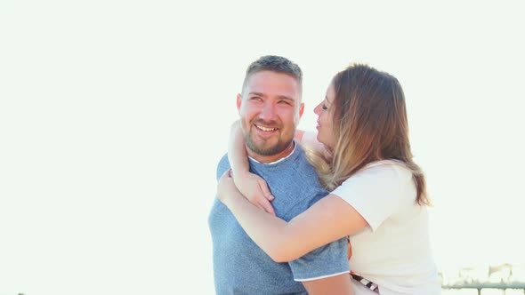 a Man and a Woman in Love Hugging and Having Fun on the Sea Beach