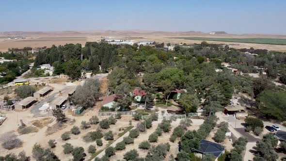 Aerial slide to the right  drone shot of a panoramic view of kibbutz Sde-Boker and the area around i