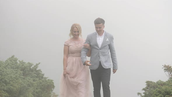 Couple walking on a foggy day