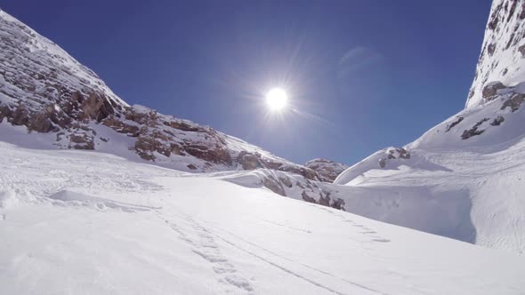 Action shot of falling downhill skier in the Dolomites