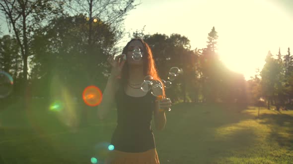 Redhair Ginger Woman Playing with Soap Bubbles, Outdoor Having Fun