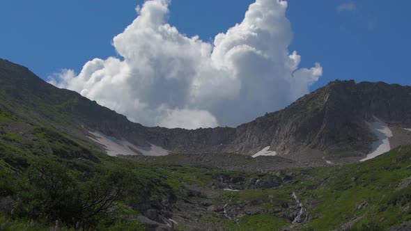 Cumulus Cloud in Blue Sky Over Mountain