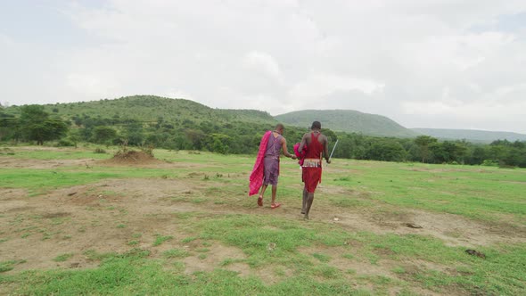 Two Maasai men walking