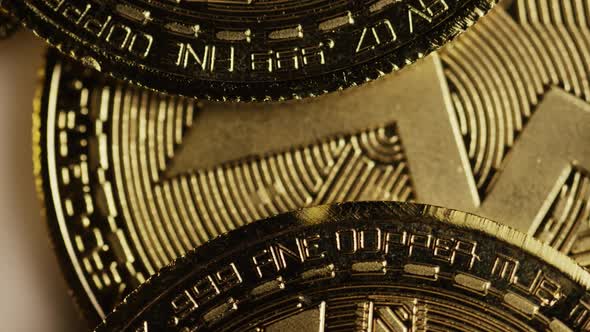 Rotating shot of Bitcoins (digital cryptocurrency) - BITCOIN MONERO 059
