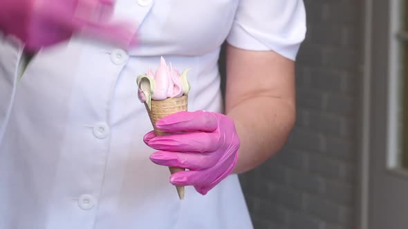 A Woman Makes Marshmallows In Waffle Cones. With The Help Of A Pastry Cone. Close Up