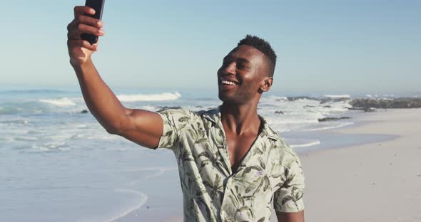 African American taking a selfie seaside
