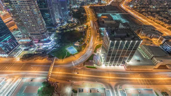 Traffic on the Road in Jumeirah Lakes Towers District Aerial Night Timelapse