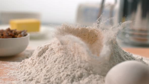 Egg falling into flour in super slow motion, shot on Phantom Flex 4K