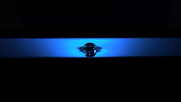 Water ripple with blue lightr, Slow Motion