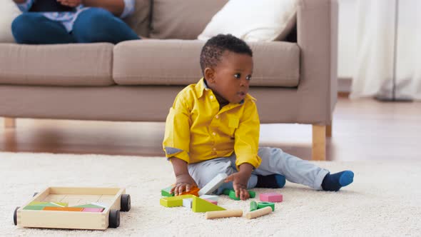 African American Baby Boy Playing with Toy Blocks 1