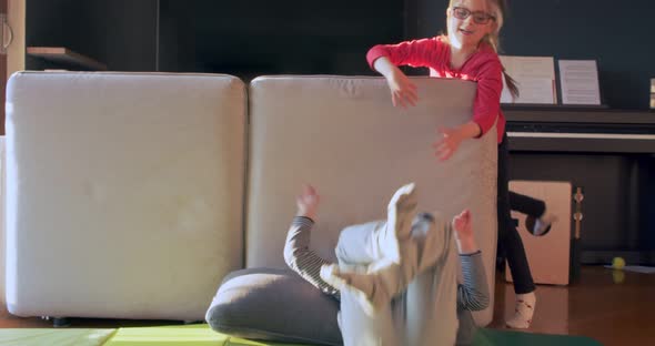 Two Children Playing Together at Home