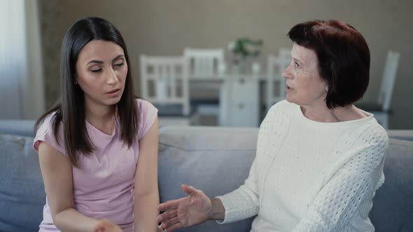 Mother Giving Advice to Upset Daughter