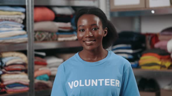 Portrait View of the Multiracial Woman in Volunteer t Shirt Looking at the Camera with Smile