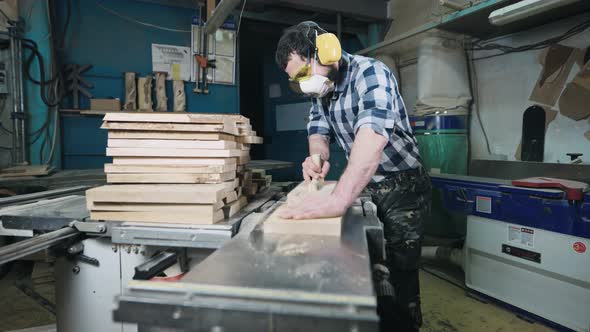 A Man Works with a Planer