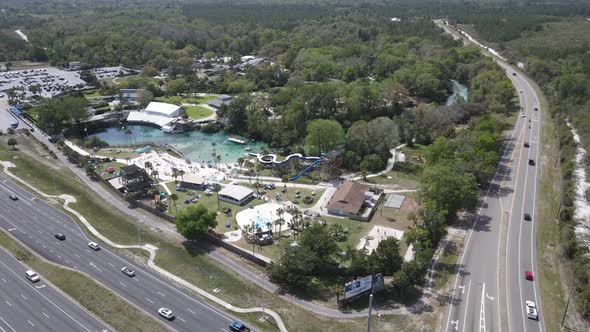 An aerial orbit of Weeki Wachee Springs State Park and the tourist attractions in Florida.  Generati