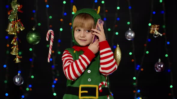 Kid Girl Christmas Elf Santa Claus Helper Costume Making Congratulations Call Mobile Phone