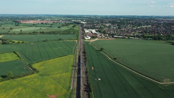 Railway in the countryside and trains passing, aerial view