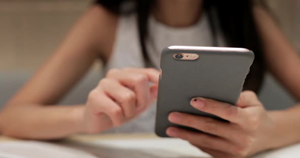 Woman Using Mobile Phone in Coffee Shop 