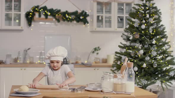 Cute Little Girl Baking in Kitchen on Christmas