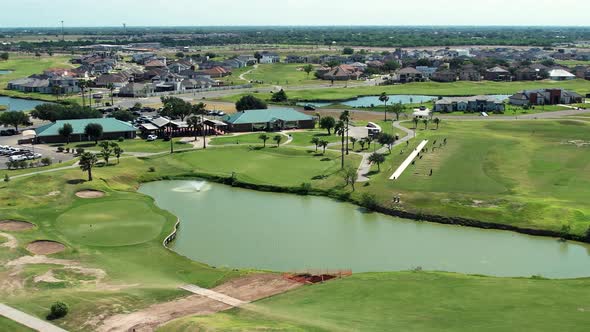 SUNNY DAY EDINBURG TX GOLF COURSE, PEOPLE PLAYING GOLF, RIO GRANDE VALLEY. GOLF CAR, DRONE FOOTAGE