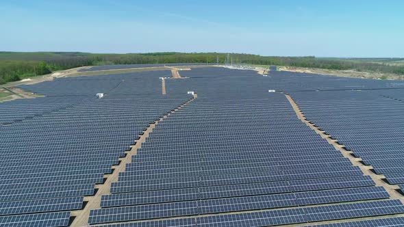 Aerial View of Solar Power Station Field at Sunny Day. Aerial Top View of Solar Farm. Renewable