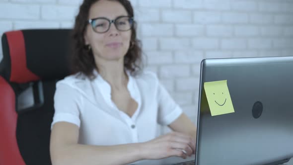 Happy woman at the computer.