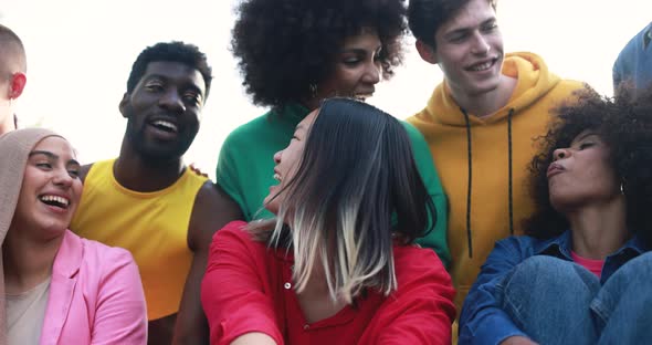 Young diverse people having fun outdoor laughing together - Diversity concept