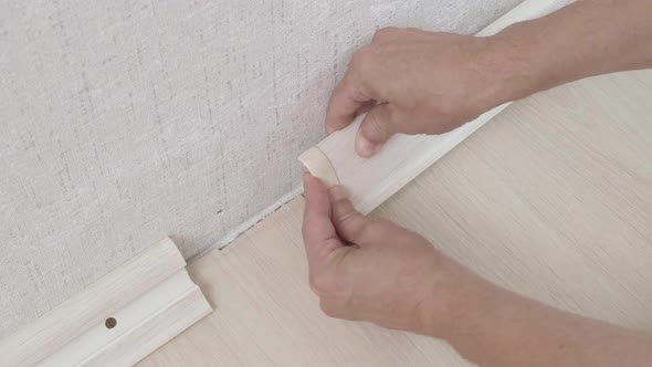 The Craftsman Puts a Decorative End Cap on the Plastic Baseboard