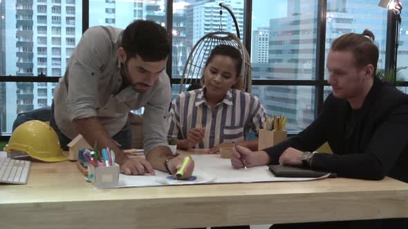 Creative Business People Group Having Conversation at Office Desk in Workplace