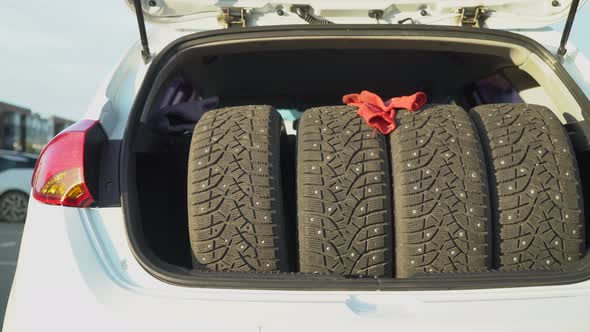 Winter tires inside a car trunk
