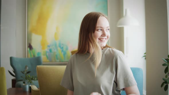 Beautiful Young Woman with Cup of Coffee