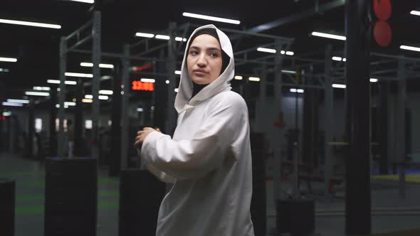 Portrait of a Muslim Woman During a Sports Workout in a Modern Fitness Room