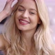 Delighted Woman Touching Hair and Looking at Camera - VideoHive Item for Sale