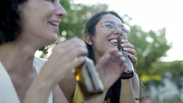 Cheerful Female Friends Drinking Beer
