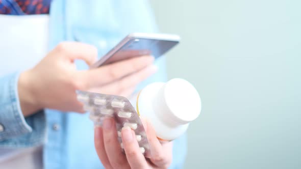 Unrecognizable Woman Reading Online Medication Instructions