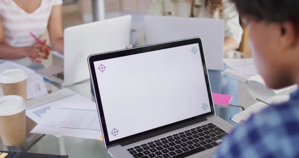 Close up of african american man working on laptop with copy space