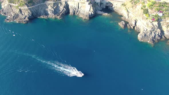 Aerial view of a boat at Cinque Terre coast, Italy