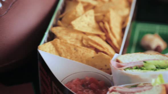 Football Snack Stadium filled with sub sandwiches, veggies and chips.