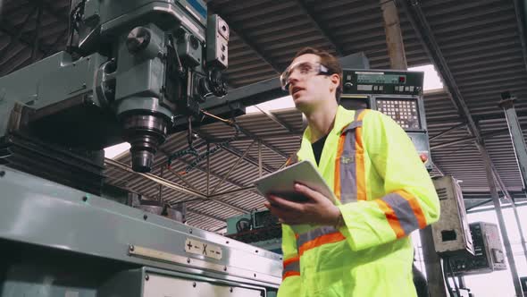 Factory Worker Warn Coworker About Safety and Give Hardhat to Him