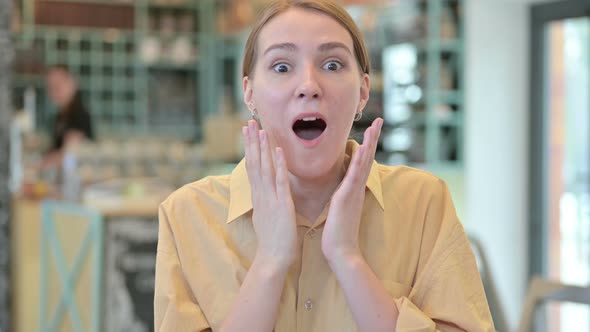 Portrait of Beautiful Young Woman Feeling Surprised