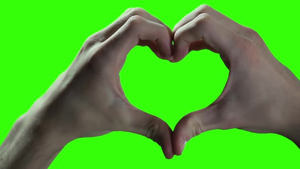 Two Hands Making Heart Sign on Green Screen.