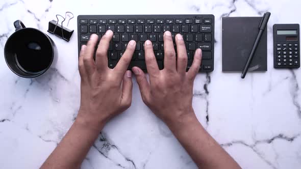  Young Man in Suffering Wrist Pain While Typing on Keyboard 