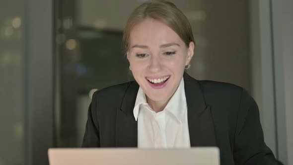 Close Up of Businesswoman Celebrating with Fest in Office at Night