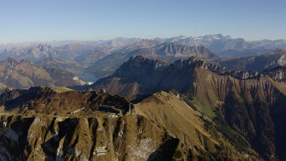 High aerial orbit around summit in the Swiss Prealps (Rochers de Naye, Switzerland). Numerous summi