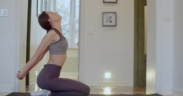 Side Portrait Sensual Woman Stretching Before Meditation Sitting Home Interior Background